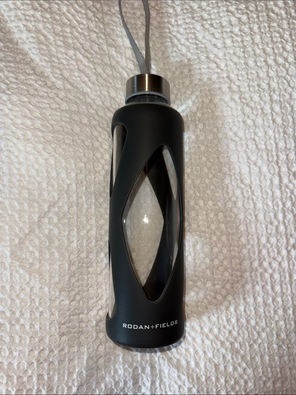 Rodan + Fields Black Glass Bottle with Silicone Sleeve